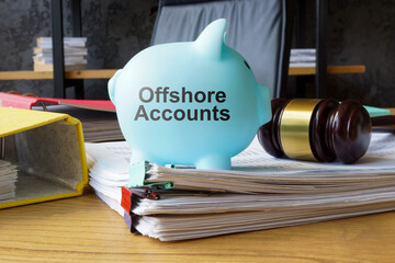 Piggy bank with the phrase offshore accounts. Tax evasion concept