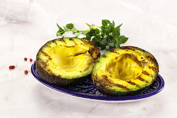 Sliced fresh avocado on the grill