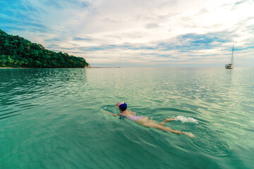 person swimming in the tropical lagoon © avtk