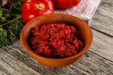 Diced ripe tomato with sauce