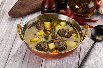 Soup with beef meatballs and vegetables
