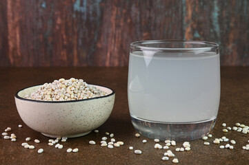 Barley water in a glass cup.