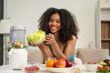 Fit woman enjoys healthy fruit breakfast after yoga training. fitness, nutrition, home lifestyle.