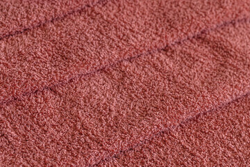 abstract background of stacked pink terry towels close up shallow depth of field