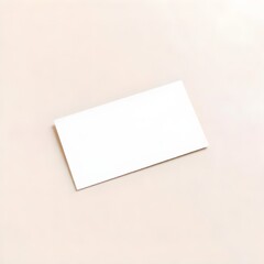 Blank business card mockup at an angle on light surface. Elegant and minimal design