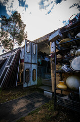 abandoned junkyard, forgotten items, dusty bottles, antiques, cluttered interiors, old clothing,...