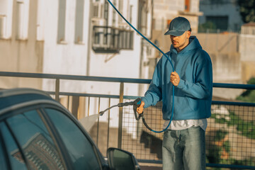 young man washing the car