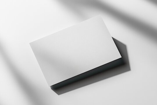 Minimalist design showcasing blank card on smooth surface with s