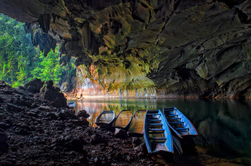 Boat rafting in beautiful caves. Kong Lor Cave in Phu Hin Bun National Park, Laos- Khammouane...