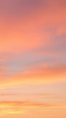 Obraz premium Pastel Sunset with Soft Clouds - Vertical Phone Wallpaper Background