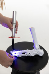 Educating a physician using a lifelike leg replica