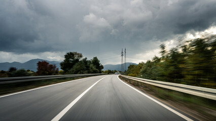 Rainy Highway View Capturing Speed and Reckless Driving on a Stormy Day