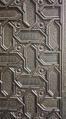 Artistic details of the Gate of Forgiveness in the Patio de los Naranjos, Seville, Spain