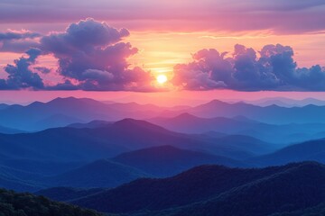 Obraz premium Vibrant sunset over layered blue mountains.