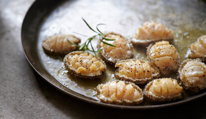 Grilled abalone in a pan
