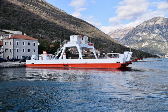 Car Ferry at the Bay of Kotor, in the Verige strait, between the villages of Kamenari and Lepetane. Bay of Kotor, Montenegro, March 2020. 