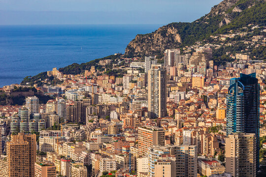 Aerial view of the luxurious high-rise buildings and Mediterranean coastline in the Principality of Monaco.
