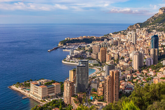 Aerial view of the luxurious cityscape of Monaco with high-rise buildings along the Mediterranean coast