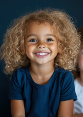 A Portrait of a Young Boy Smiling-Blode Curly Hair-Smiling Expression