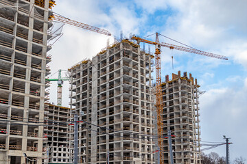 Construction of the third stage of a new residential complex 'in the forest'. Work construction cranes, is the construction of walls of buildings. Moscow, Russia