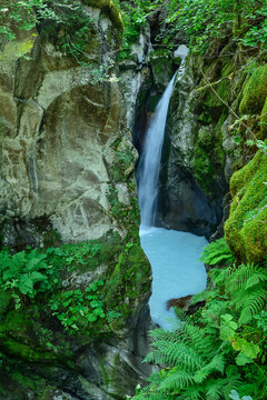 Waterfall of Torrent de Tre la Tete amidst forest in France