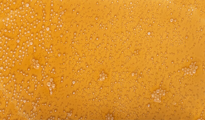 Spilled soda texture, soft drink puddle, liquid stain, beer splatter, brown sparkling water with bubbles