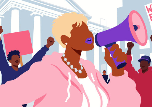 Activist with blond hair speaking through megaphone
