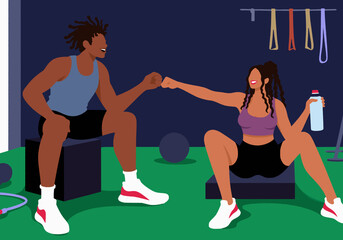 Happy woman and man giving fist bump to each other at gym