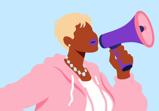 Woman with blond hair speaking through megaphone