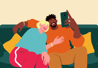 Smiling couple taking selfie through smart phone sitting on sofa
