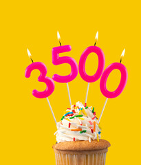 Candles forming the number 3500 - Yellow background