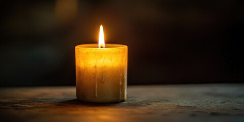 A single candle burning in a quiet, somber setting, symbolizing grief and remembrance.