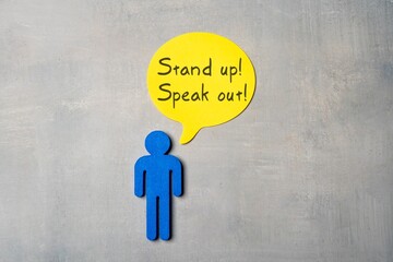 A blue figure and a yellow speech bubble with the text 