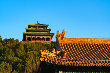 Wanchun Pavilion of Jingshan Park under blue sky in morning sunlight