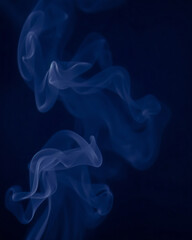 Fototapeta premium blue smoke waves on dark blue background 