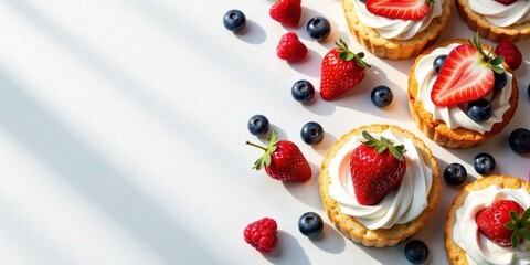Sunlit Pastry Delights Fresh Strawberry and Berry Tarts with Whipped Cream Topping on a Bright White Surface