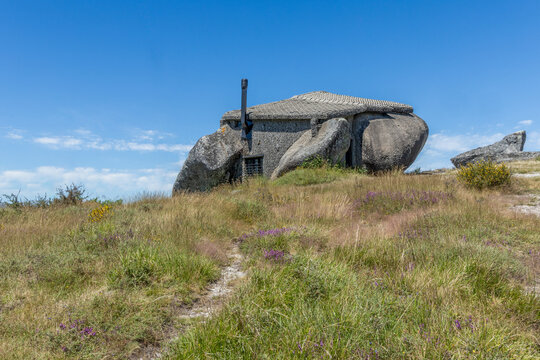 Boulder house or Casa do Penedo, a house built between huge rocks on top of a mountain in Fafe, Portugal. Usually considered one of the strangest houses in the world.