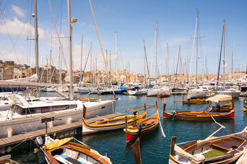 Fototapeta premium yachts and boats in the bay near Valletta pot in Malta