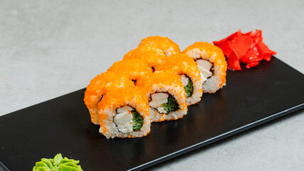 Sushi rolls on black tray