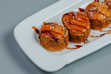 Sushi rolls on white plate