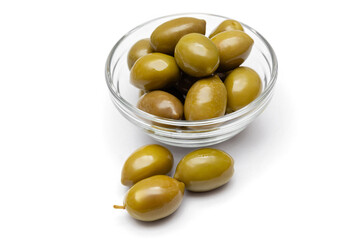 greek green olives in glass bowl on white background