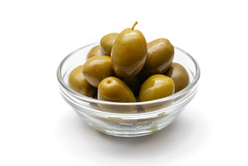 green olives in a glass bowl on a white background