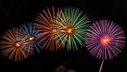 Colorful fireworks display against dark night sky