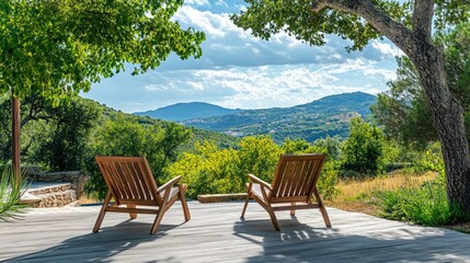 Obraz premium Relaxing terrace with wooden chairs overlooking scenic hills in a beautifully landscaped garden ideal for weekend leisure and outdoor enjoyment