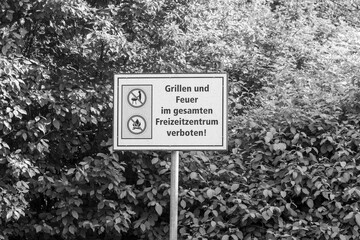 Warning sign with a barbecue grill forbidden to grill