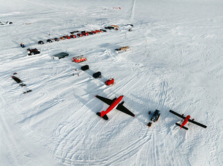 Antarctic base and scientific research station on the Antarctic peninsula. Top view. Red plane sits...
