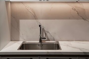 Durable chrome kitchen tap paired with a rectangular steel sink