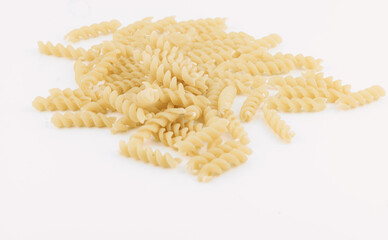 Dried pasta spirals on white background.  Perfect for recipes and food photography.