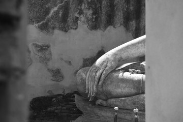 hand of ancient Buddha at Wora Chet Tha Ram temple travel location in Thailand