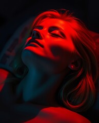 Dramatic Portrait of a Young Woman Bathed in Red and Blue Light